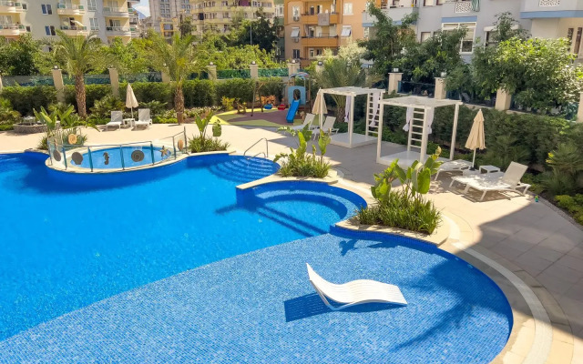 Апартаменты 1+1 Qoople Aria 07 в центре Алании