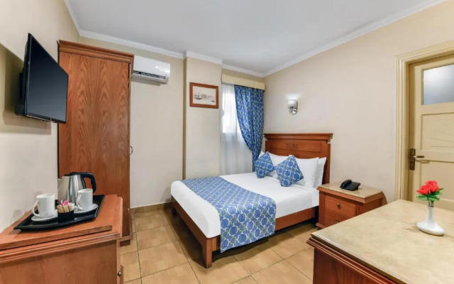 Отель Aura Inn Tiba Pyramids