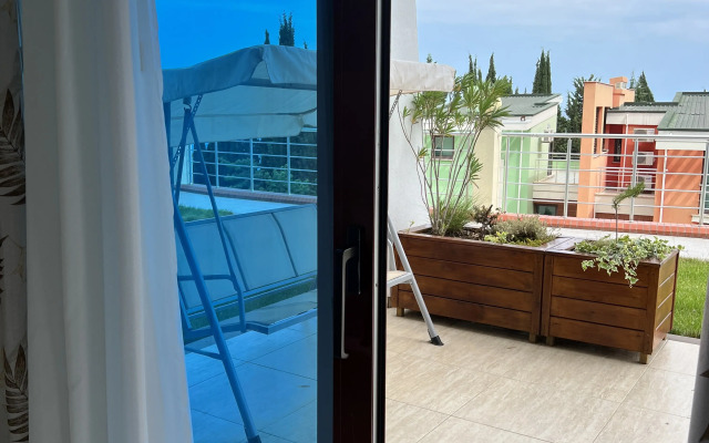 Апартаменты Олива с зоной патио и отдельной спальней