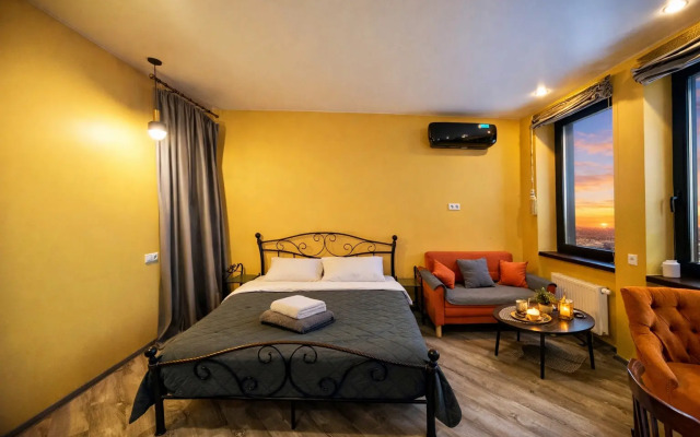 Апартаменты Уютная просторная студия рядом с НМИЦ ТИО Шумакова