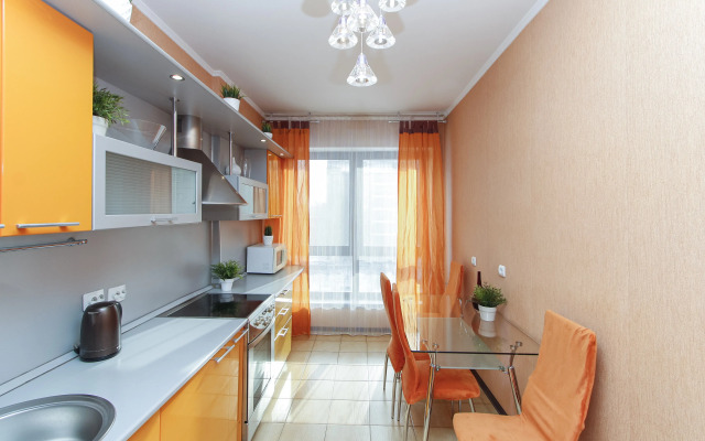 Апартаменты с двуспальной кроватью кухней и гостинной