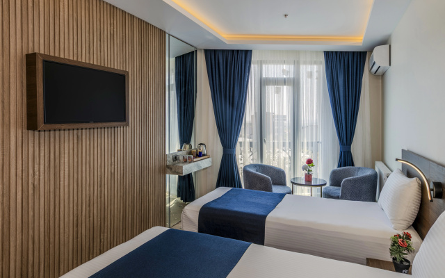 Трёхместный номер Deluxe с видом на город — фото 3