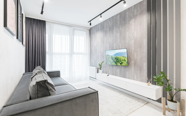 Dizaynerskiye na 24 Etazhe s Ponoramnymi Oknami Apartment