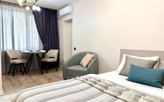 Современная студия в центре Апартаменты