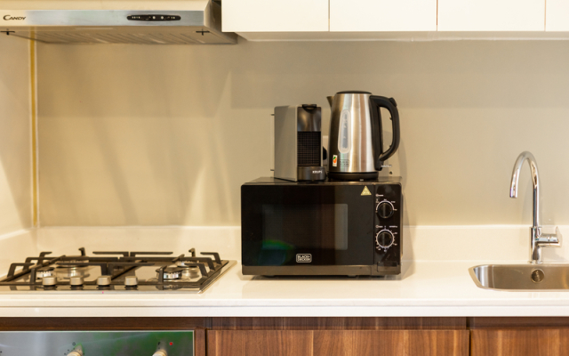 Апартаменты Luxurious 1BR at Keyrock Pool & Gym Access