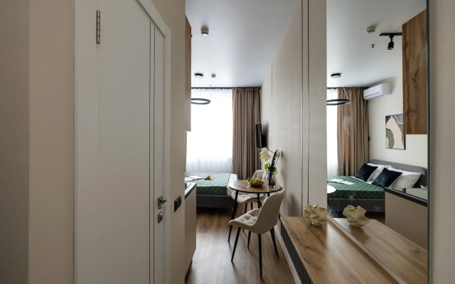 Апартаменты Уютная Студия у Метро Ботанический Сад