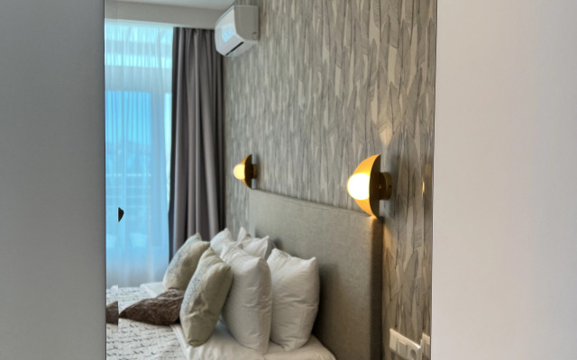 Апартаменты магнолия с зоной патио и отдельной спальней