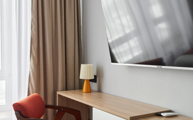 Апартаменты Уютная студия с видом на город и реку