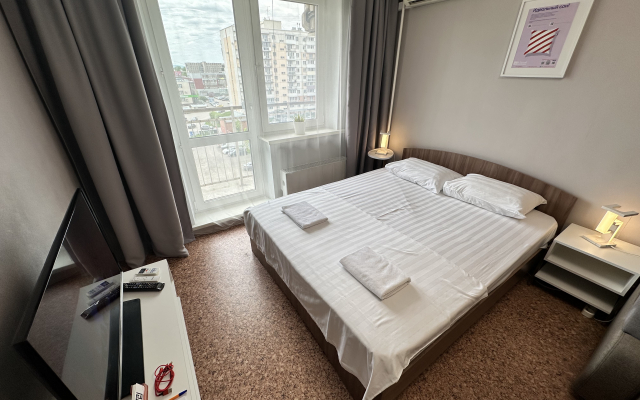 Апартаменты В Гости! на Строителей 90б (студия на 6 этаже)