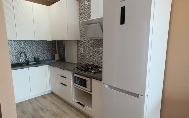 V Novom Dome Flat