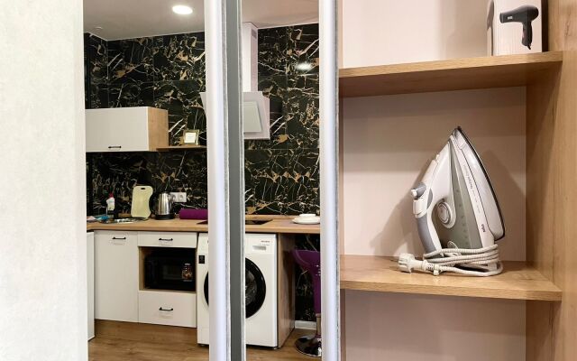 V Tsentre Goroda Apartments