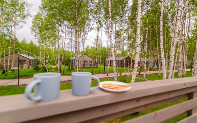 V Poselke U Vodokhranilischa Private house