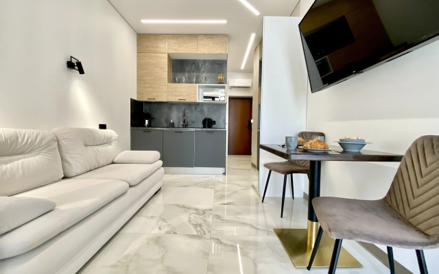 Апартаменты в отеле с подогреваемым бассейном