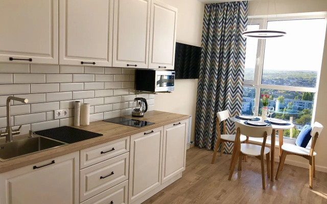 Квартира Уютная cтудия в дoме комфорт-клaсcа Рoманoв New Life