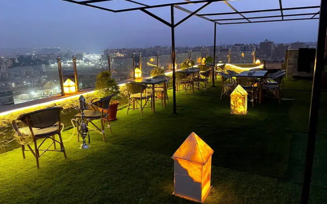 Отель Pyramids Tour View Inn
