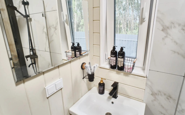 Частный дом с сауной, детской и спортивной площадкой