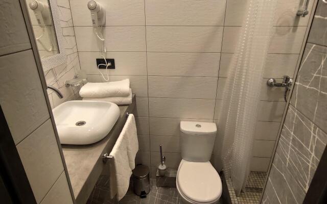 V Tsentre Goroda Apartments