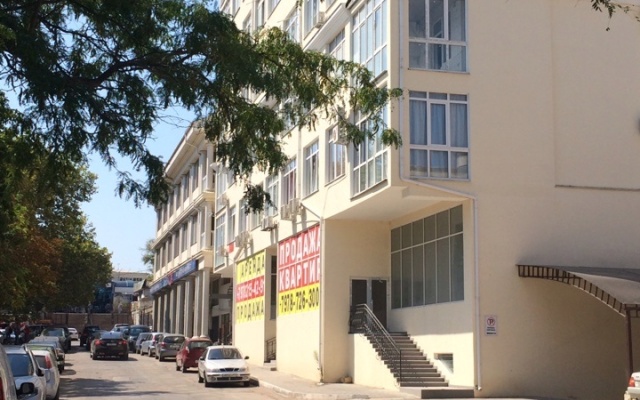 V Tsentre Goroda Apartments