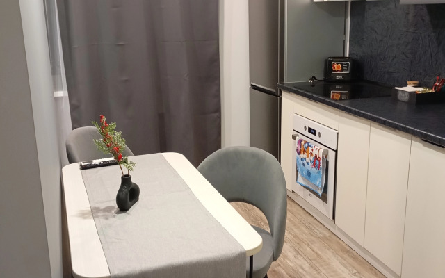 Квартира Уютная студия в рядом с ДРКБ