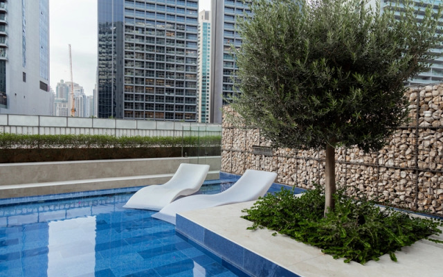 Апартаменты Luxurious 1BR at Keyrock Pool & Gym Access