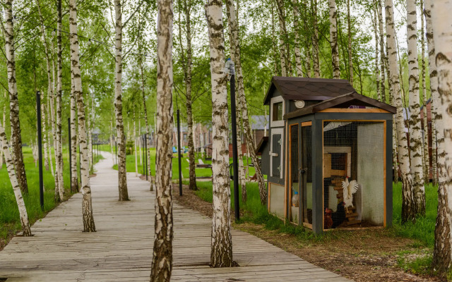 V Poselke U Vodokhranilischa Private house