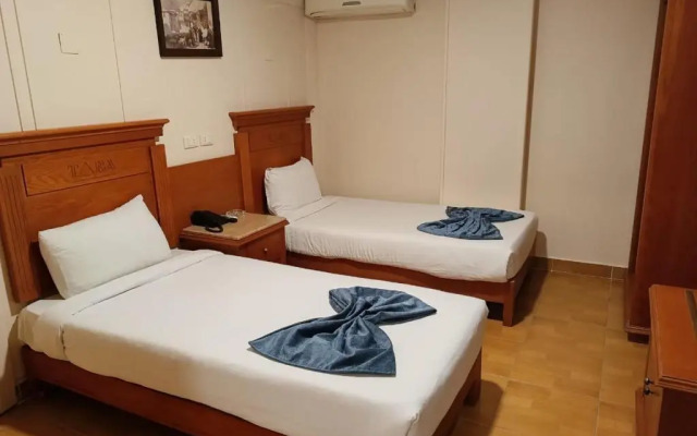 Отель Aura Inn Tiba Pyramids