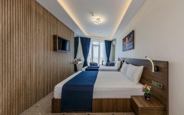 Трёхместный номер Deluxe с видом на город — фото 1