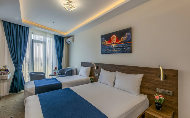 Трёхместный номер Deluxe с видом на город — фото 4