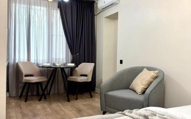 Современная студия в центре Апартаменты