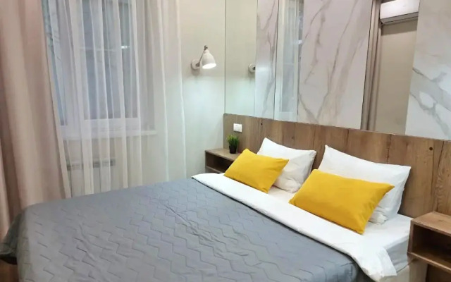 V Tsentre Goroda Apartments