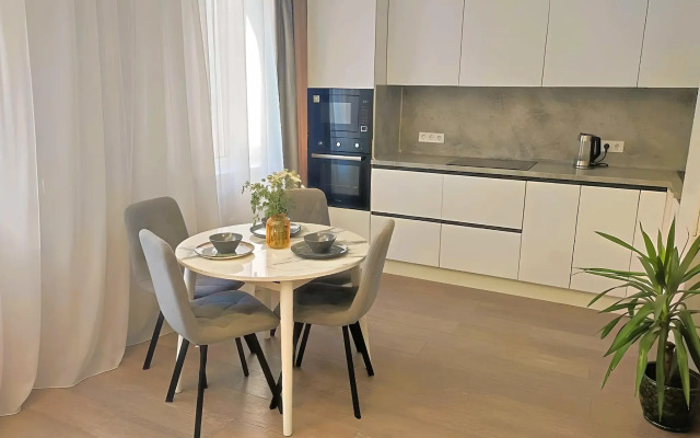 TatAparts oranzhevaya idilliya v sovremennoy studii Apartments