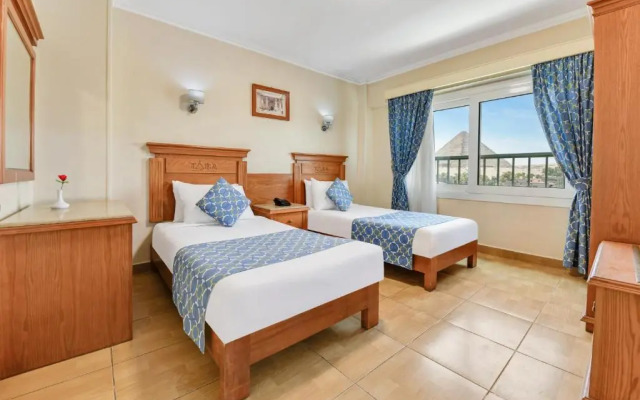 Отель Aura Inn Tiba Pyramids