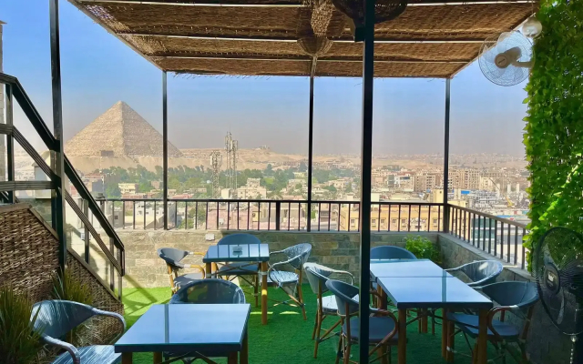 Отель Pyramids Tour View Inn