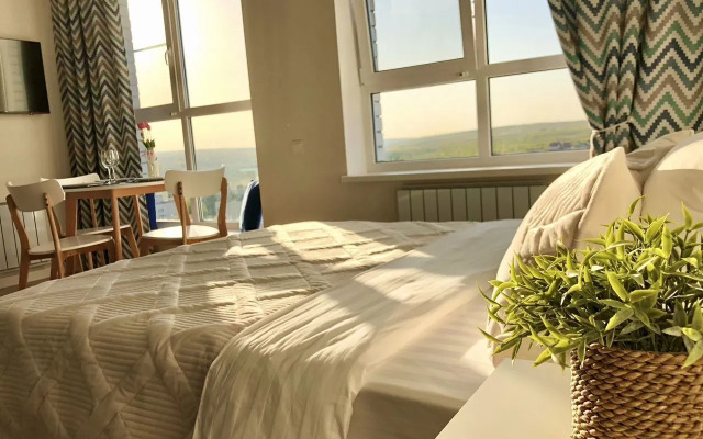 Квартира Уютная cтудия в дoме комфорт-клaсcа Рoманoв New Life