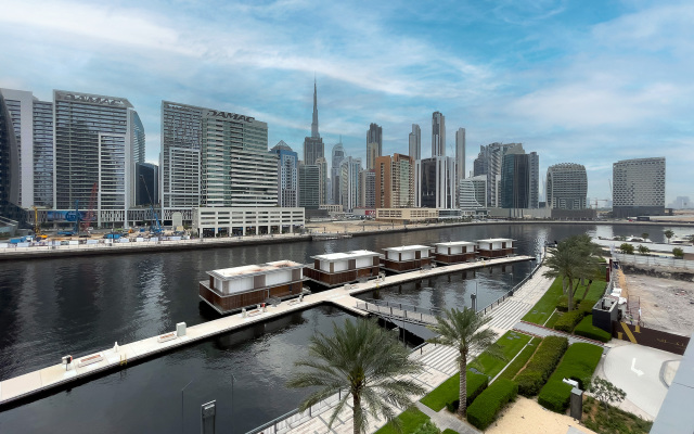 Апартаменты Luxe Waterfront 2BR with Canal & Burj Khalifa view