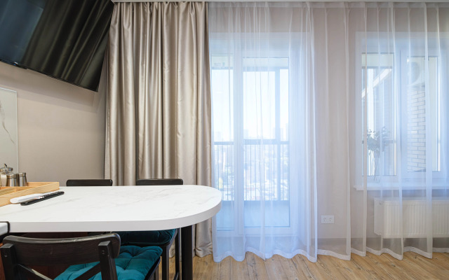 Квартира Новая студия в 5 минутах от ТРЦ Аура