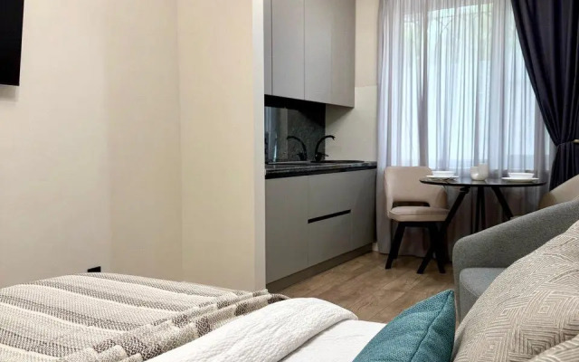 Современная студия в центре Апартаменты