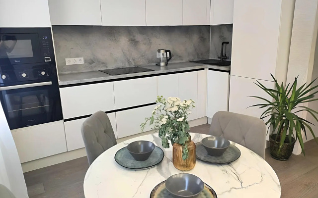 TatAparts oranzhevaya idilliya v sovremennoy studii Apartments