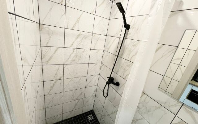 V Tsentre Goroda Apartments