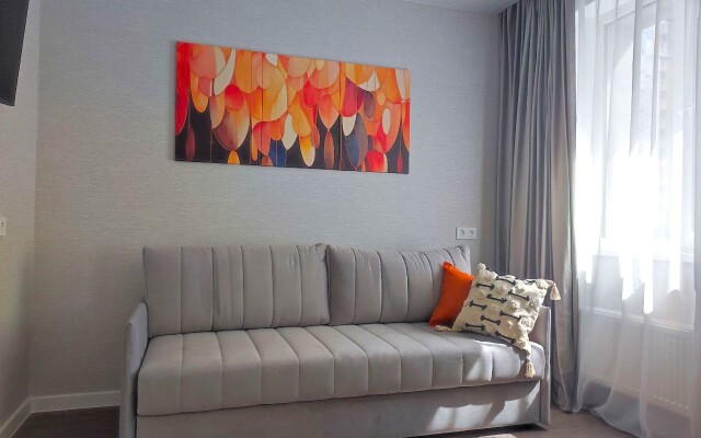 TatAparts oranzhevaya idilliya v sovremennoy studii Apartments