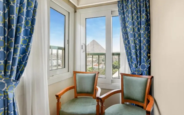 Отель Aura Inn Tiba Pyramids