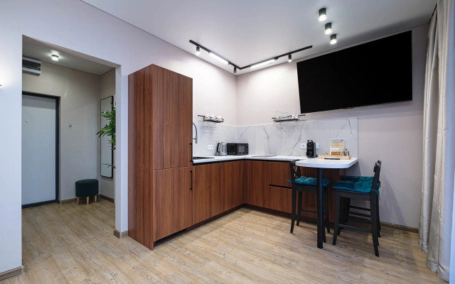 Квартира Новая студия в 5 минутах от ТРЦ Аура