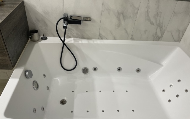 Квартира Уютная квартира в центре с сауной и джакузи