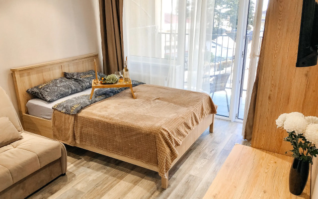 Апартаменты Бежевая кофейная студия у моря