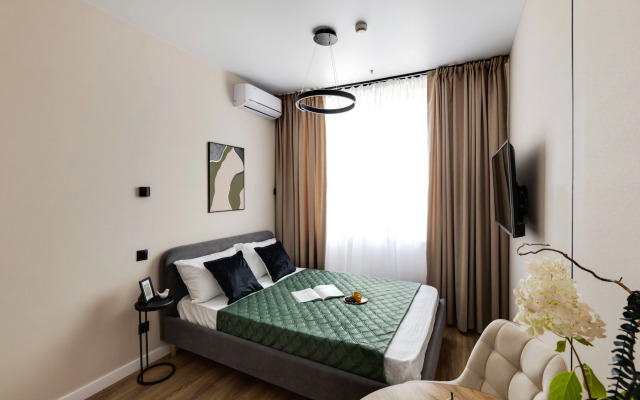 Апартаменты Уютная Студия у Метро Ботанический Сад