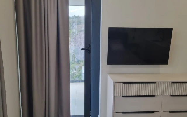 Uyutnaya Studiya s Pryamym Vidom na More Apartments