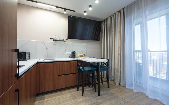 Квартира Новая студия в 5 минутах от ТРЦ Аура