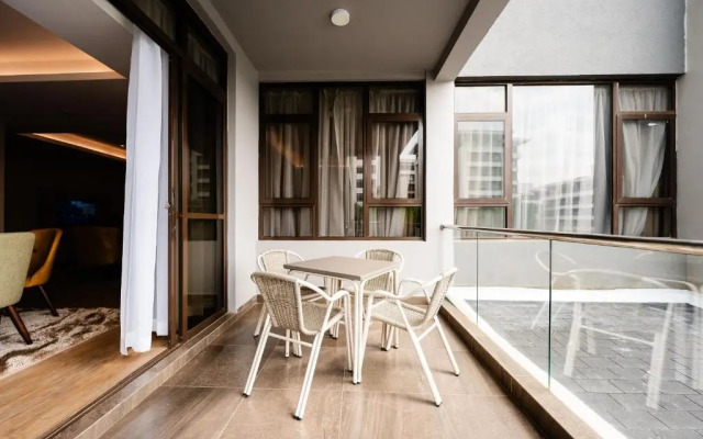 Отель Trademark Suites at Enaki Town