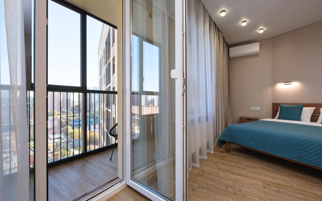 Квартира Новая студия в 5 минутах от ТРЦ Аура