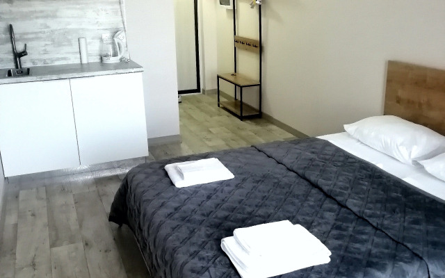 V Tsentre Goroda Apartments